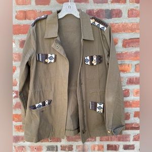 Green army jacket with embroidered sleeves and pockets
